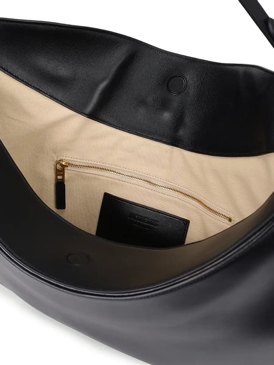 Сумка кожаная La Sac Ovalo JACQUEMUS 25HBAW00437AC18A08 990 Черный  Фото 4