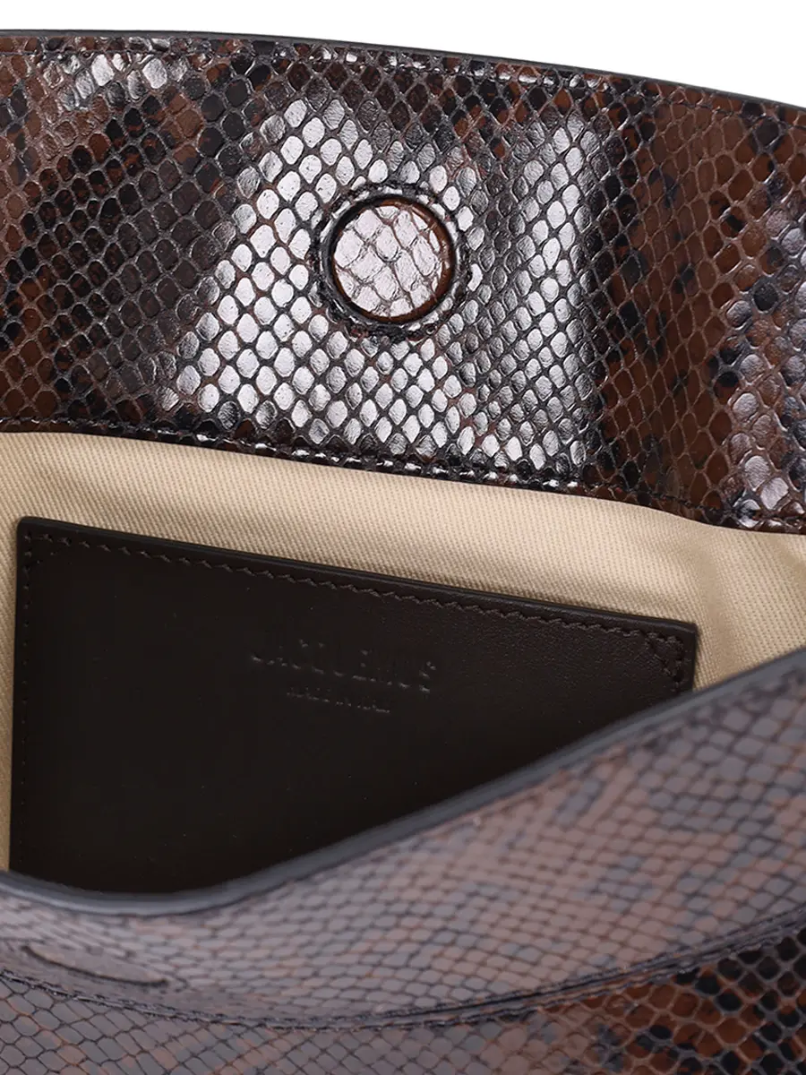 Сумка кожаная La Pochette Ovalo JACQUEMUS 25HBAW00438AC05A01 880 Коричневый  Фото 4